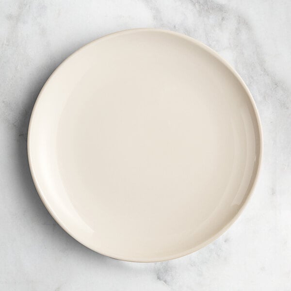 An Acopa Highlands white china plate on a white background.
