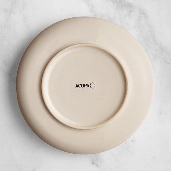 An Acopa Highlands white china plate with black text that says "Birch" on it.