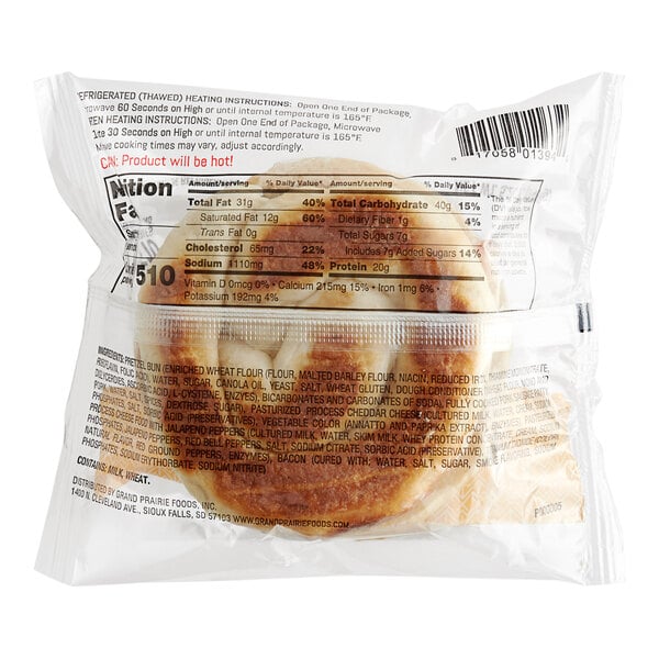 A package of Grand Prairie Sausage, Bacon, and Cheese Pretzel Bun Sandwiches on a white surface.