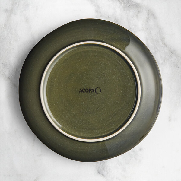 An Acopa Highlands juniper green china plate with a white rim.