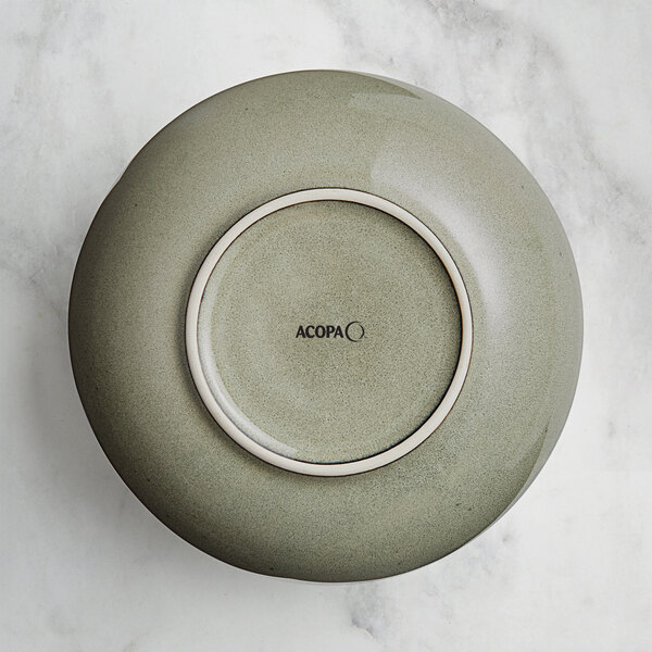 A grey Acopa Highlands china bowl on a marble surface.