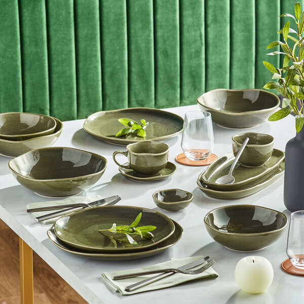 A table set with juniper green Acopa bowls and mugs.