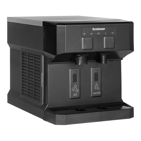 A black Scotsman Meridian ice and water machine on a counter with two dispensers.