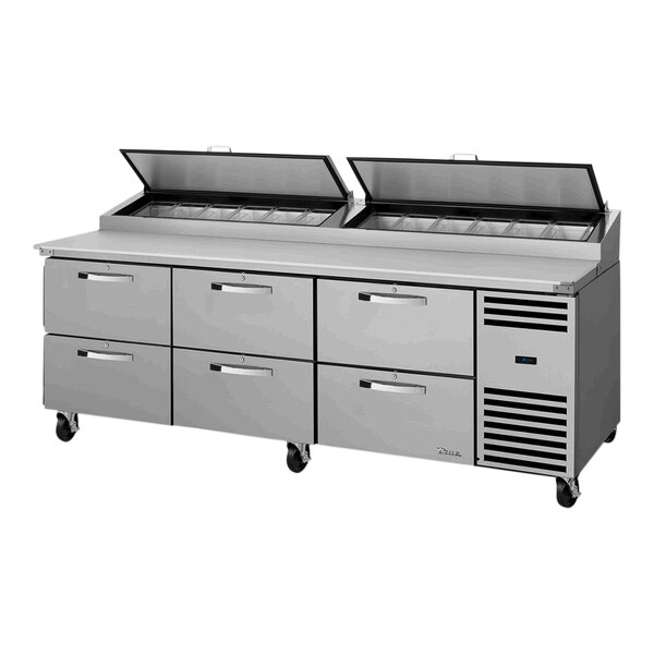 A True refrigerated pizza prep table with six drawers.