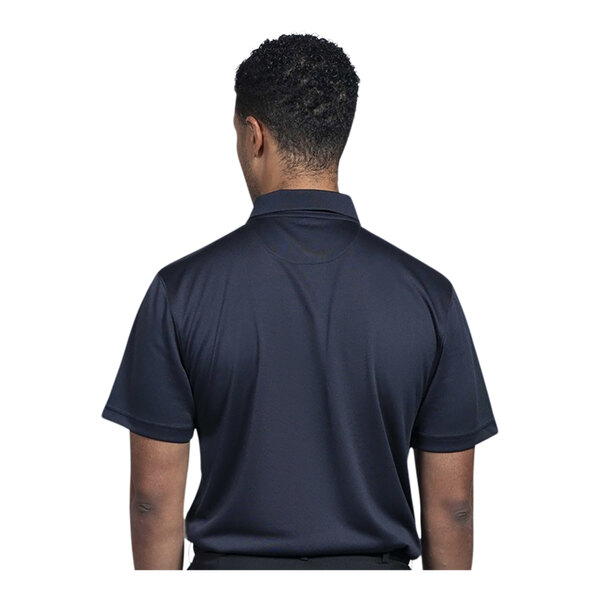 A man wearing a navy short sleeve polo shirt.