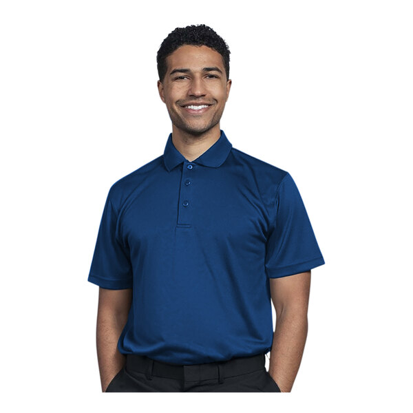 A man wearing a royal blue Uncommon Chef polo shirt.