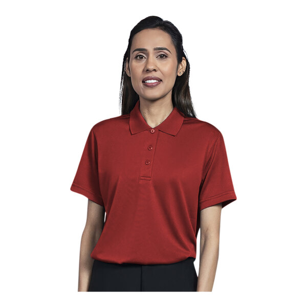 A woman wearing a red Uncommon Chef short sleeve polo shirt.