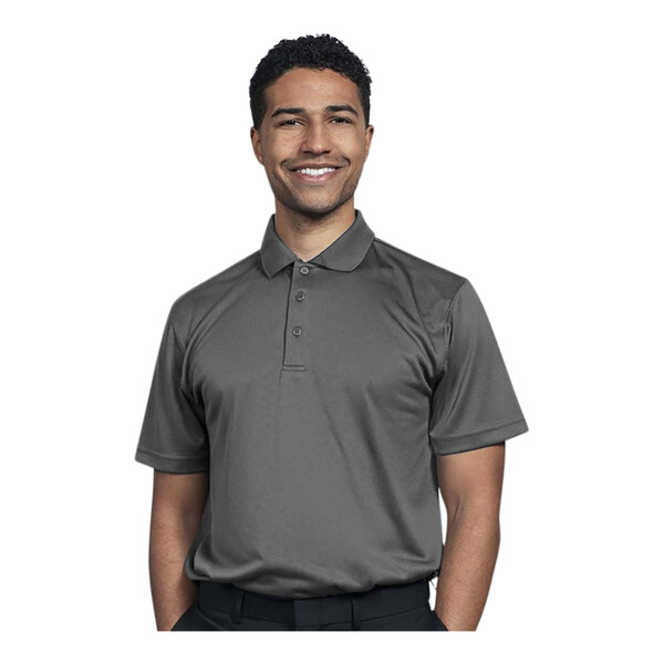 A man wearing a Uncommon Chef gray polo shirt smiling.