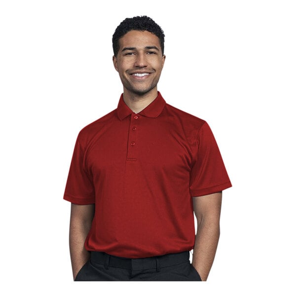 A man wearing a Uncommon Chef red short sleeve polo shirt and smiling.