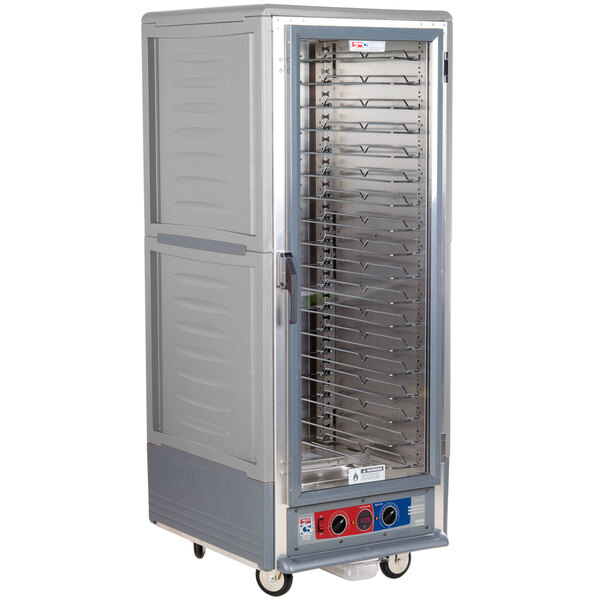 A gray Metro C5 heated holding and proofing cabinet with shelves and wheels.