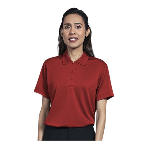 A woman wearing a red Uncommon Chef polo shirt.