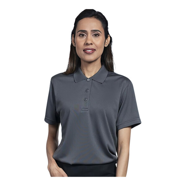 A woman wearing a grey polo shirt.