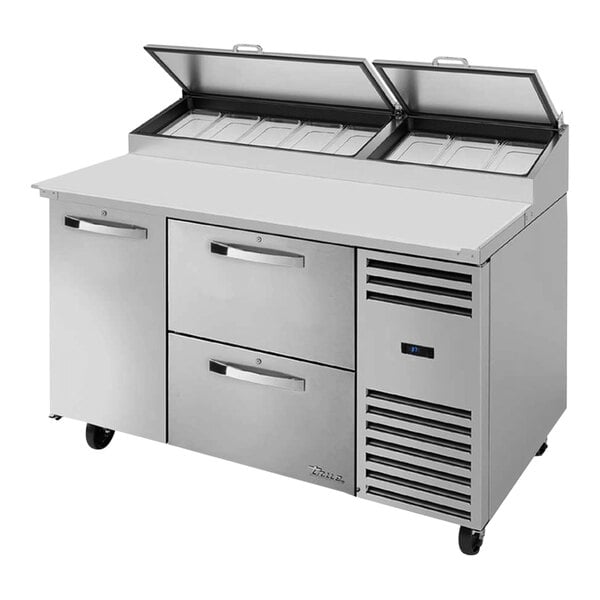 A True stainless steel refrigerated pizza prep table with drawers and a door.