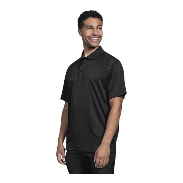 A man wearing a black Uncommon Chef polo shirt with a white logo smiling.