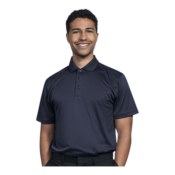 A man wearing a navy Uncommon Chef polo shirt.