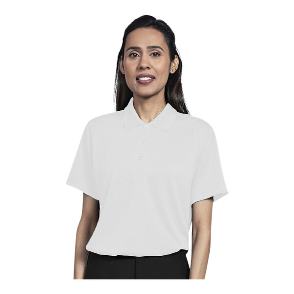 A woman wearing a white Uncommon Chef polo shirt.