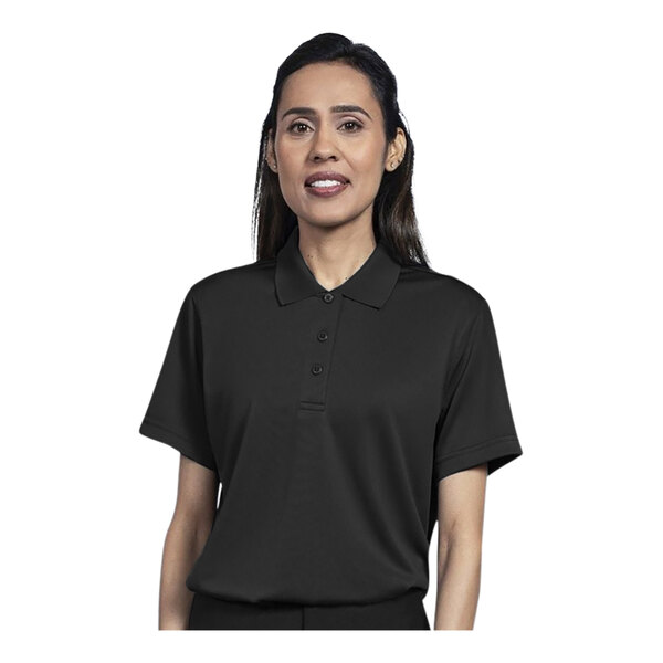 A woman wearing a black Uncommon Chef polo shirt.