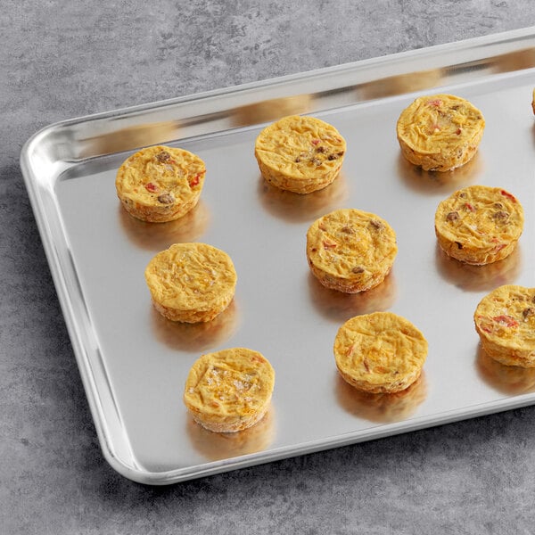 Cuisine Innovations Turkey Sausage Omelet Bites on a tray on a gray surface.