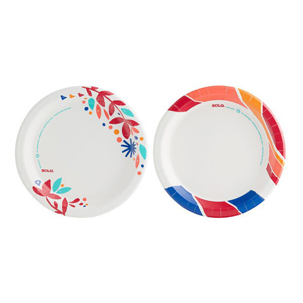 A pair of round paper plates with colorful floral and geometric designs on the rims.