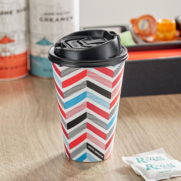 A Solo paper hot cup with a black lid.