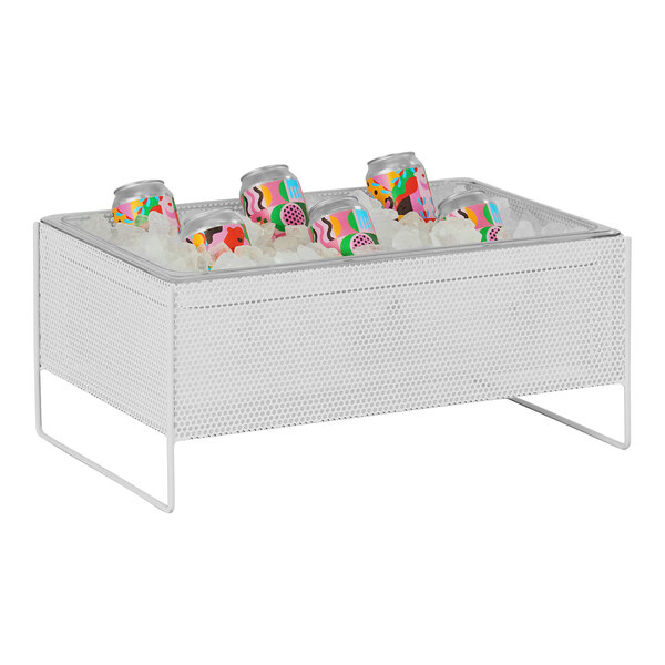 A Cal-Mil white metal ice housing with clear pan filled with ice and cans.