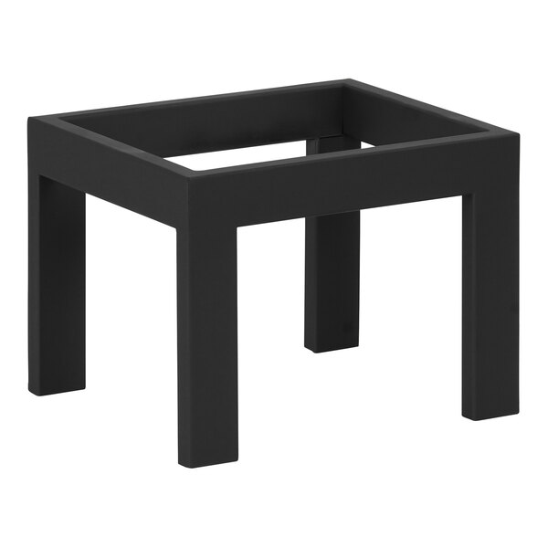 A black metal rectangle display riser on a table with legs.