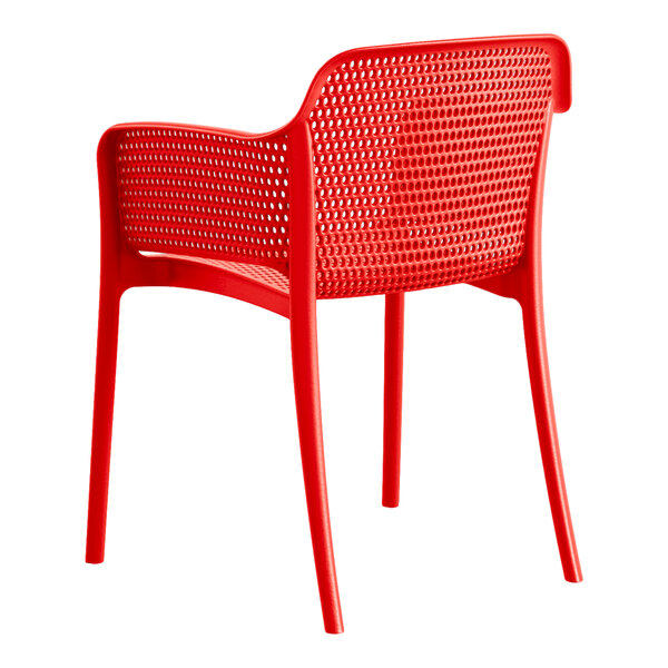 A red resin arm chair by Lancaster Table & Seating.