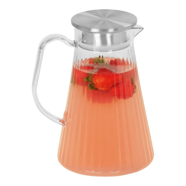 A Cal-Mil polycarbonate pitcher filled with water and strawberries.