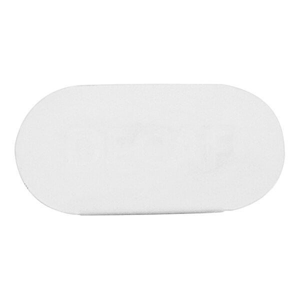 A white oval metal sign with black dots.