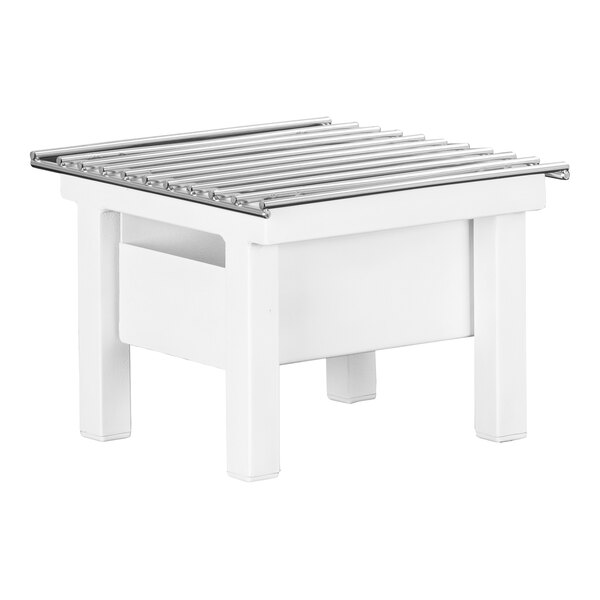 A white rectangular metal chafer alternative with metal rods on top.