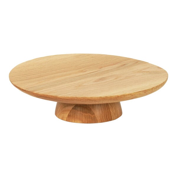 A Cal-Mil Sydney round oak cake stand with a wooden base.