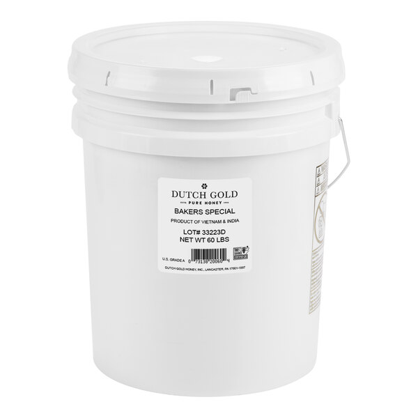 A white bucket of Dutch Gold Baker's Special Honey with a label on it.