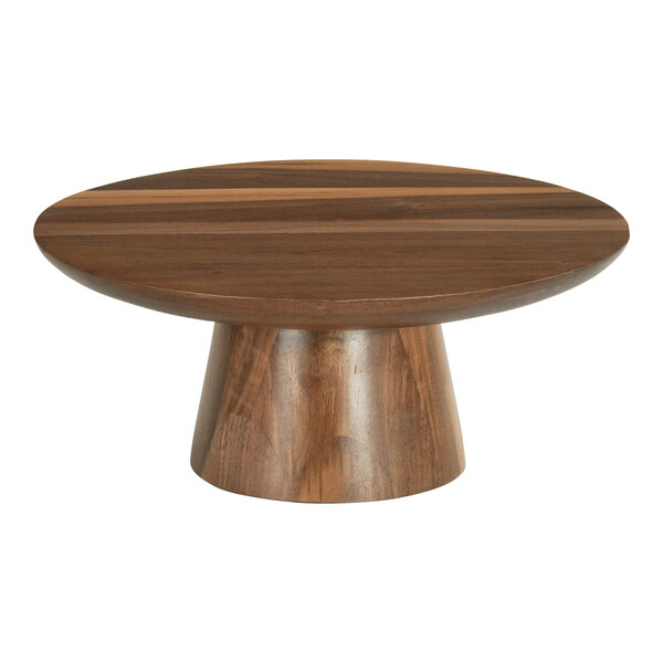 A Cal-Mil Sydney round walnut cake stand on a wooden table.