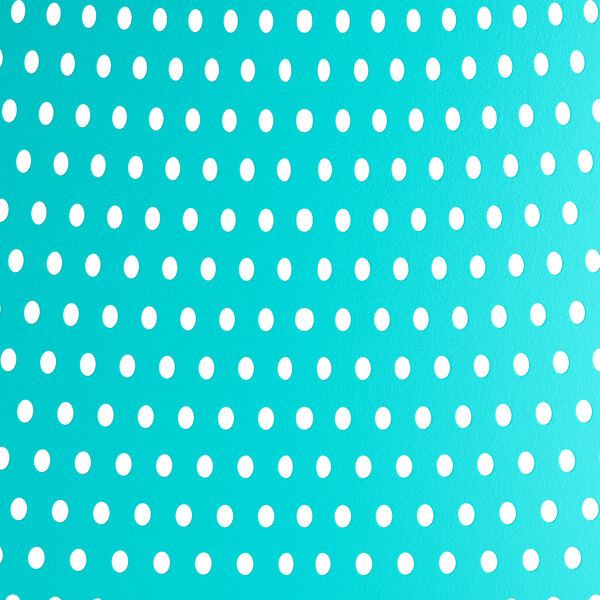 A white background with a blue and white polka dot Lancaster Table & Seating Rio Coastal Blue Resin Arm Chair.