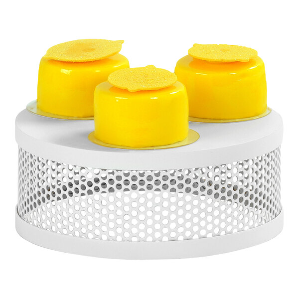 A group of yellow lemon slices on a white Cal-Mil display stand.