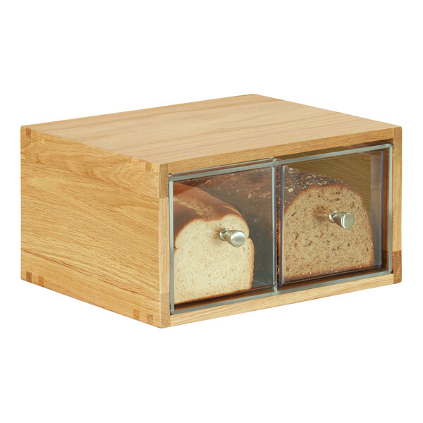 A wooden bread box with two loaves of bread inside.