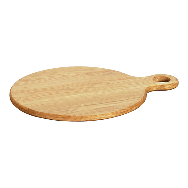 A Cal-Mil oak round serving board with a handle on a wood surface.