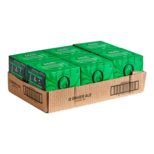 A box of Q Mixers Premium Ginger Ale cans with green designs.