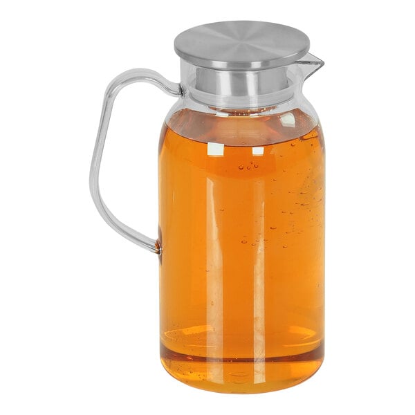 A clear polycarbonate pitcher with a stainless steel lid.