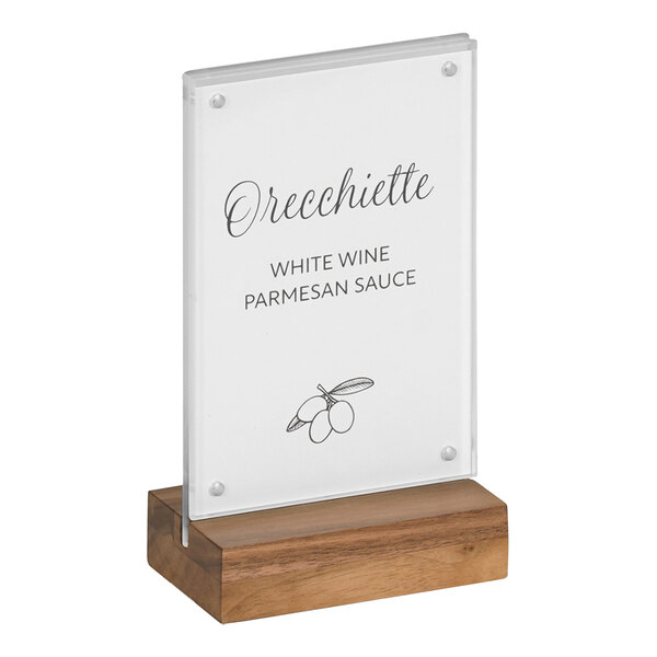 A Cal-Mil walnut base card holder with black text on a white sign.