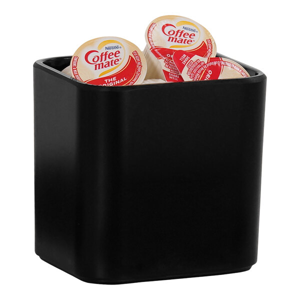 A black Cal-Mil crock with round containers inside.