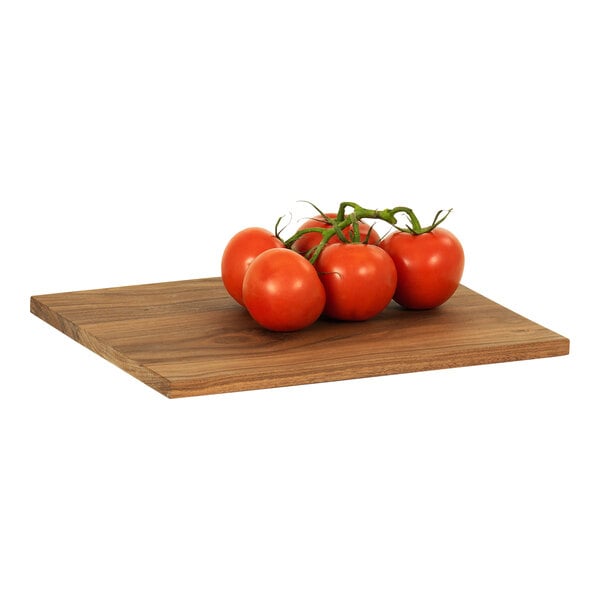 A Cal-Mil walnut rectangular serving board with tomatoes on it.