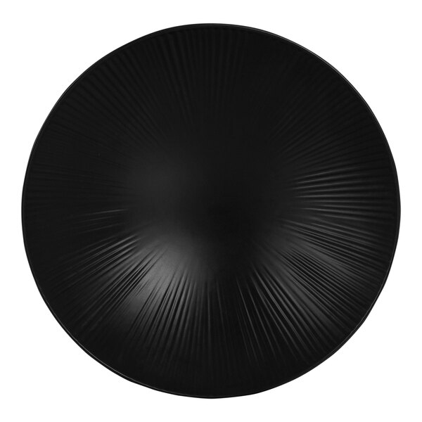 A black round melamine serving bowl with a spiral design inside.
