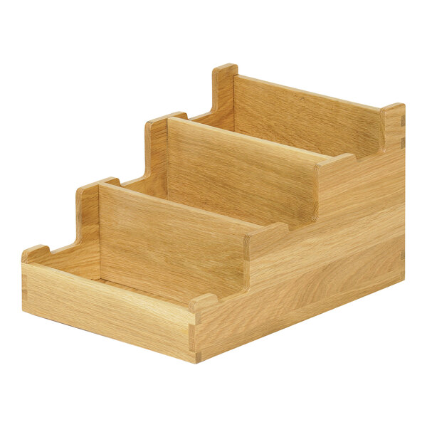 A wooden flatware organizer with three compartments.