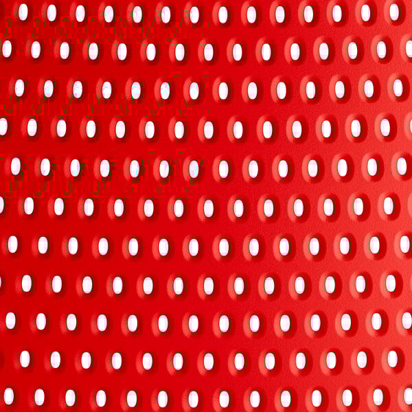 A red resin Lancaster Table & Seating Rio side chair with holes.