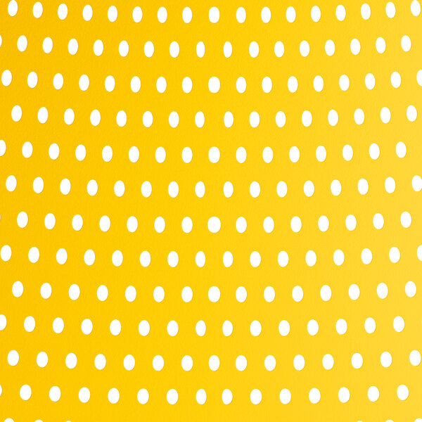 A yellow resin arm chair with a white background and yellow dots.