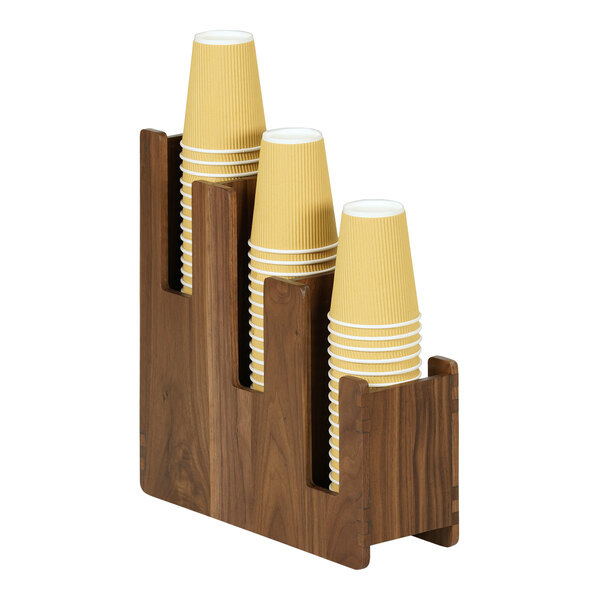 A group of paper cups in a wooden Cal-Mil Sydney cup holder.