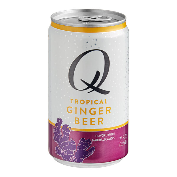 A close up of a Q Mixers Tropical Ginger Beer can with a purple and yellow label.