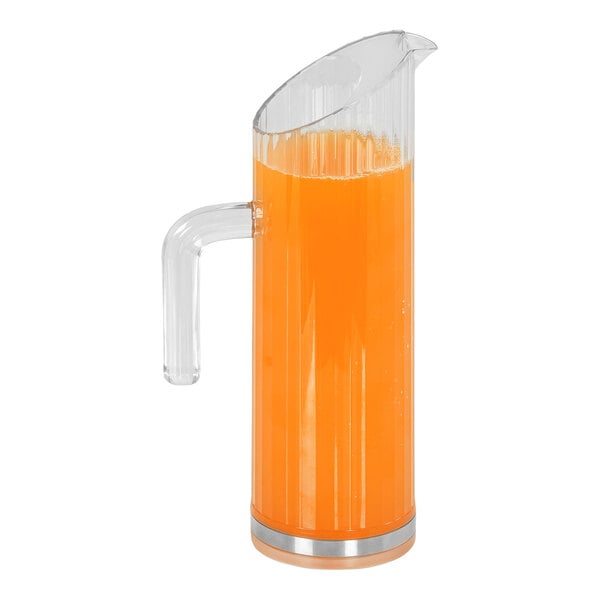 A Cal-Mil ribbed polycarbonate pitcher with orange liquid inside.