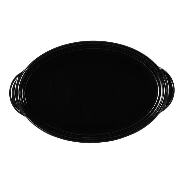 A black oval Cal-Mil melamine cocotte with handles.